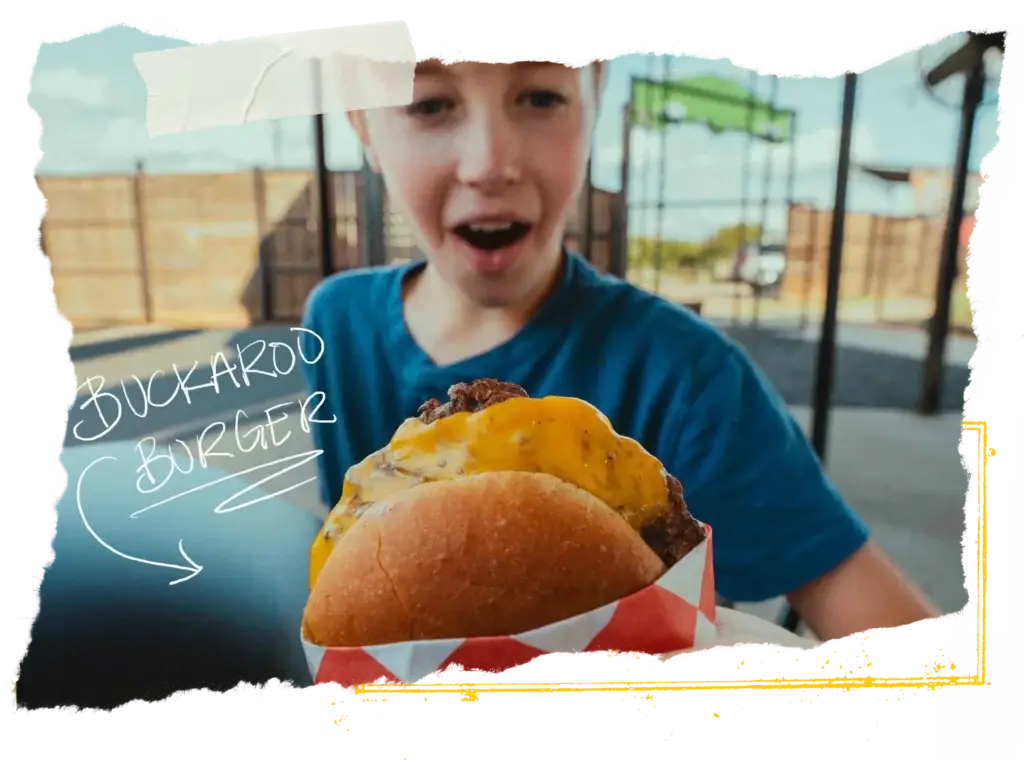 Kid holding the buckaroo burger