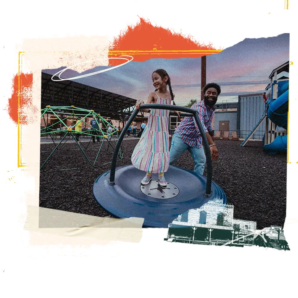 Girl and her dad on the playground at Wild Acre