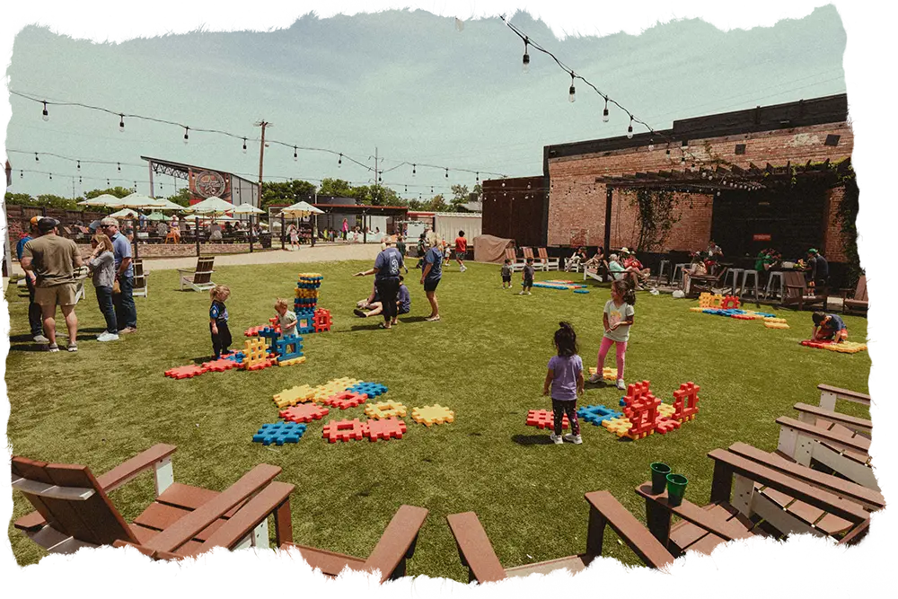 Yard games being played on the turf at Wild Acre